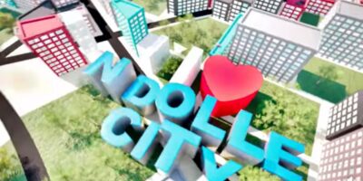 Vue 3D de Ndolle City ville nouvelle au Cameroun avec logo bleu Ndolle City et coeur rouge au centre des immeubles